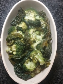 Put steamed broccoli and kale across the bottom of an oven proof dish
